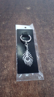 Stainless steel keychain with intricate peacock feather motif