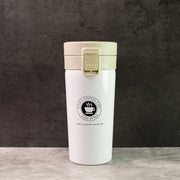 Close-up of stainless steel vacuum insulated coffee flask showing specifications