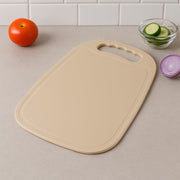 Plastic chopping board 34x23 cm with handle on kitchen counter