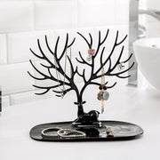 Side view of deer shaped jewellery holder showcasing antler branches and oval tray