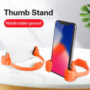 Hand shape mobile stand holding smartphone on desk