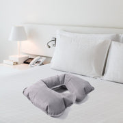 Lifestyle image using inflatable U-shape travel pillow