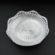 An empty round plastic tray showcasing its traditional design.