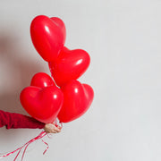 Assorted bright heart balloons adding festive charm to an event.