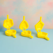 Plastic cookie cutters arranged neatly on a kitchen counter for easy biscuit making.