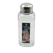 Transparent mukhwas bottle sitting on a kitchen counter with snacks