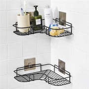 A bathroom storage rack neatly holding toiletries in the shower corner.