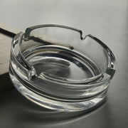 Durable crystal glass ashtray suitable for both indoor and outdoor use.