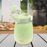 The 1200ml travel mug with its lid open, revealing a straw and included sticker sheet.