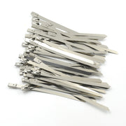 An array of durable stainless steel cable ties laid out, highlighting their uniform design and quality.