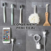 Transparent self-adhesive hook in a kitchen, holding a metal spatula.