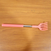 Khujli Stick back scratcher with its product packaging and included accessories.