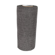 Hand demonstrating the flexible and easy-to-handle kitchen scrub cloth.