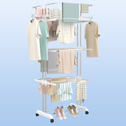 Compact foldable clothes drying rack shown partially folded for storage.
