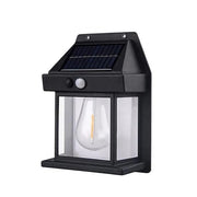 A single black solar wall lamp with a clear bulb and solar panel is displayed against a plain white background.