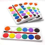 Side view of a non-toxic 12-color watercolor set with its accompanying paint brush.