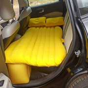 Inflatable car bed providing a cozy sleeping space in a car for a relaxed journey.