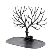 Jewellery display stand with deer antler design holding earrings