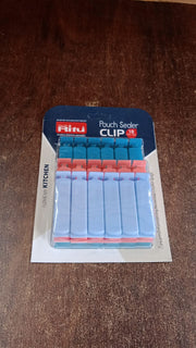 Close-up view of Ritu plastic pouch sealer clips highlighting their design.