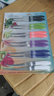 Versatile serrated knife from the 12-piece set cutting vegetables smoothly.