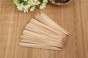 Long 20 cm bamboo BBQ skewers, versatile for various grilled foods.