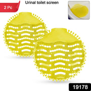 Fragrant urinal screen mat emitting fresh citrus scent for long-lasting washroom freshness.