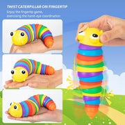 Collection of multiple rainbow plastic slug fidget toys arranged together for display.