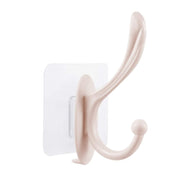 Steps showing how to easily install a plastic self adhesive wall hook on a clean surface.