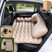 Inflated car air mattress set provides comfort in vehicle back seat.