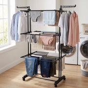 Metal expandable garment rack showing side hangers for clothes.