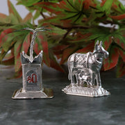 Elegant silver-plated Kamdhenu cow and Tulsi plant pair for religious blessings