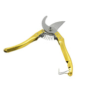 Ergonomic garden shears cleanly cutting a green stem, demonstrating their effective pruning action.
