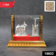 Sacred Kamdhenu cow and calf silver-plated idol with red velvet base