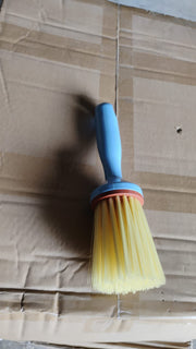 Multi-purpose plastic cleaning brush designed for kitchen and bathroom scrubbing