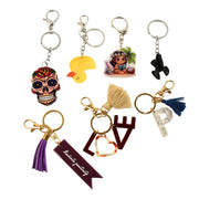 Collection of assorted designer keychains for bags and keys