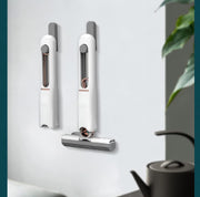 The Portable Self-Squeeze Mini Mop demonstrating its flexibility for tight spaces.